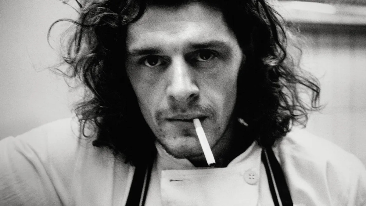 A young Marco Pierre White smoking a cigarette